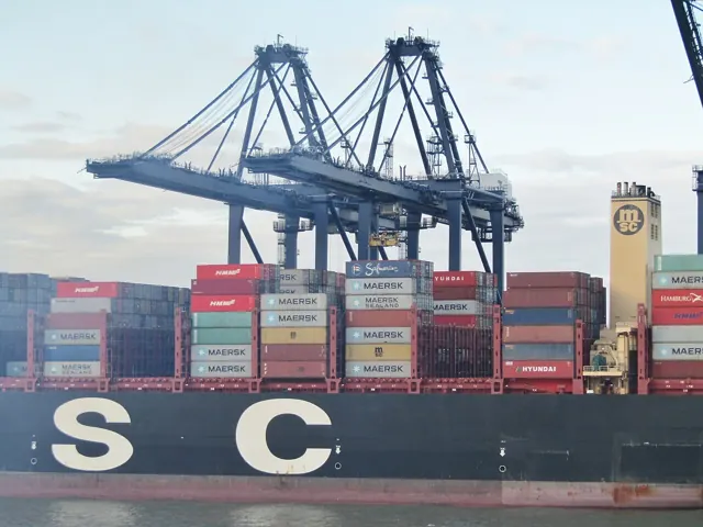 A container ship and gantry cranes at Felixstowe port.