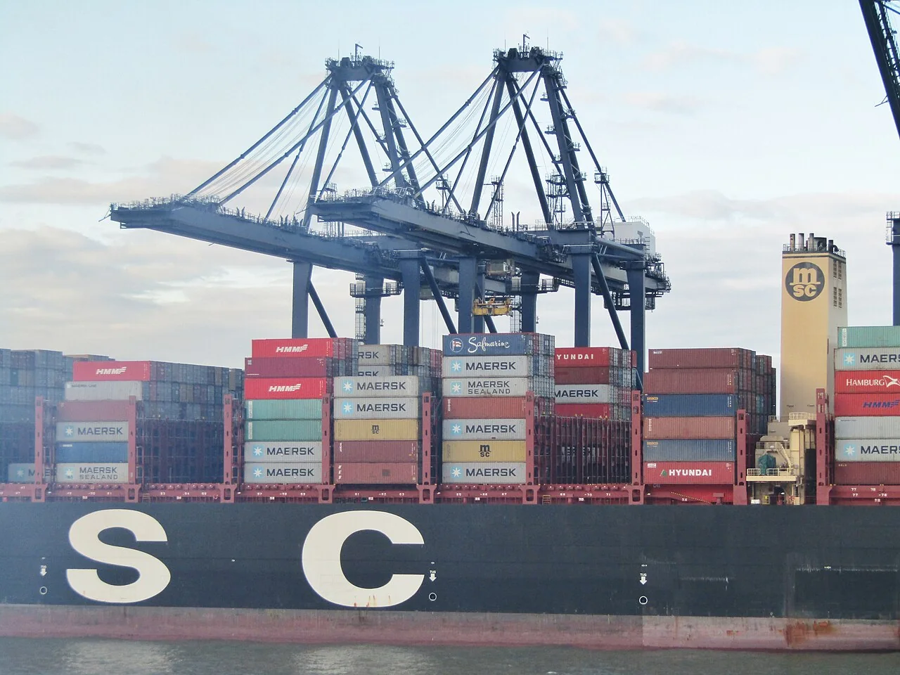 A container ship and gantry cranes at Felixstowe port.