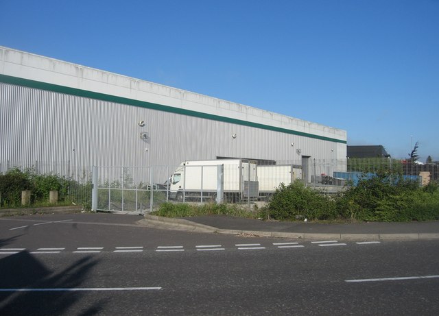 Lorries parked behind a warehouse in England
